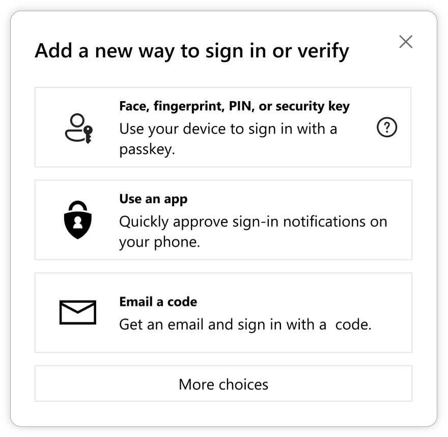 "Add a new way to sign in or verify" dialog box offering three options:

Face, fingerprint, PIN, or security key: Use a device to sign in with a passkey (accompanied by a person and key icon).
Use an app: Approve sign-in notifications on a phone (represented by a shield with a lock icon).
Email a code: Receive a code via email to sign in (depicted with an envelope icon).
A "More choices" button is displayed at the bottom.