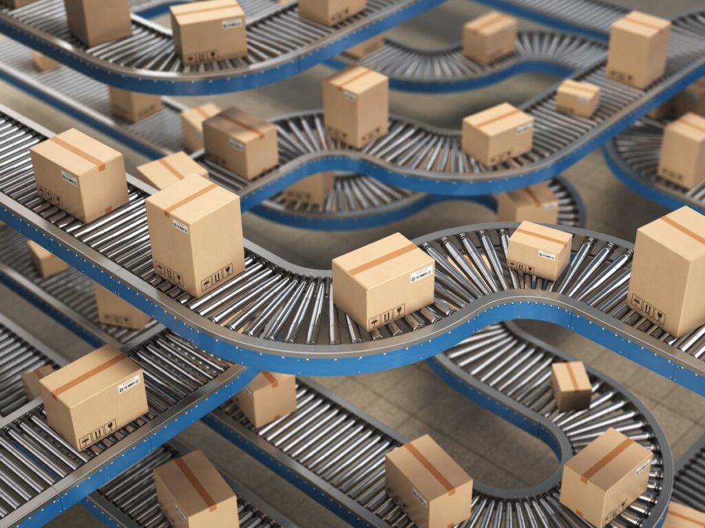 Cardboard boxes on a conveyor belt in a consumer goods manufacturing facility