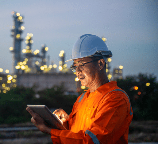 An energy employee working on a tablet