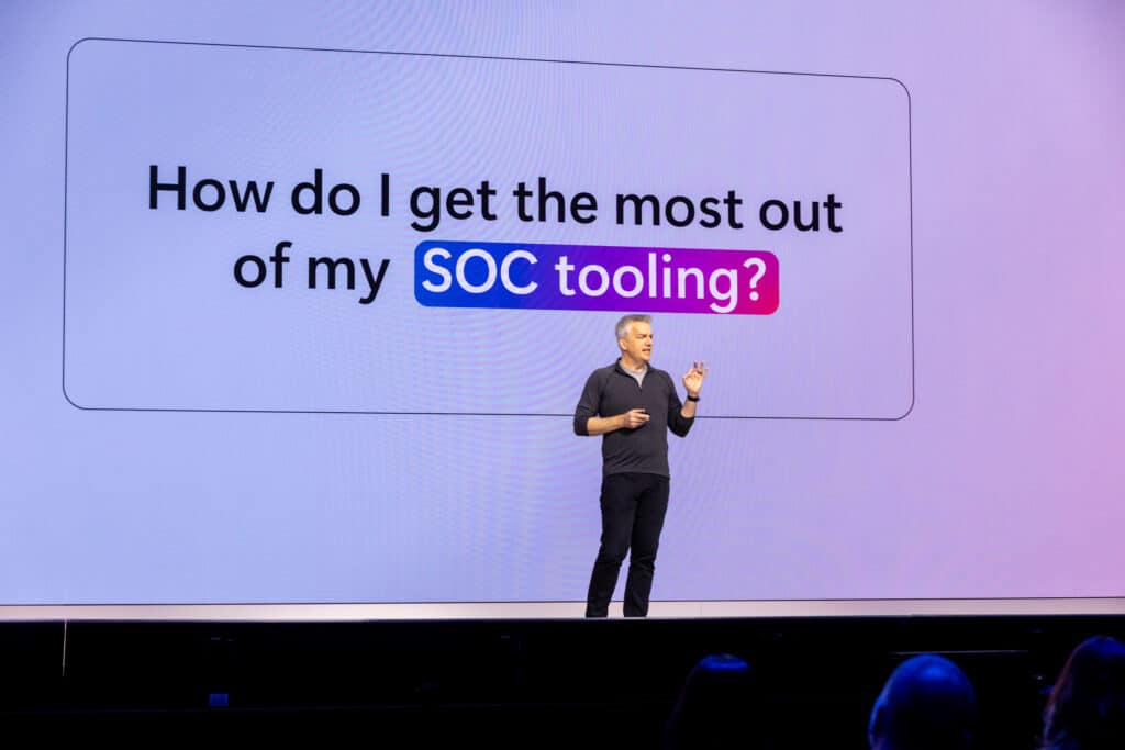 Rob Lefferts on stage in front of slide about SOC tooling.