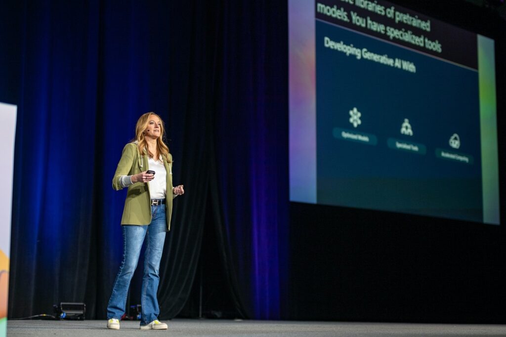 A woman presenting during the Microsoft AI Tour.